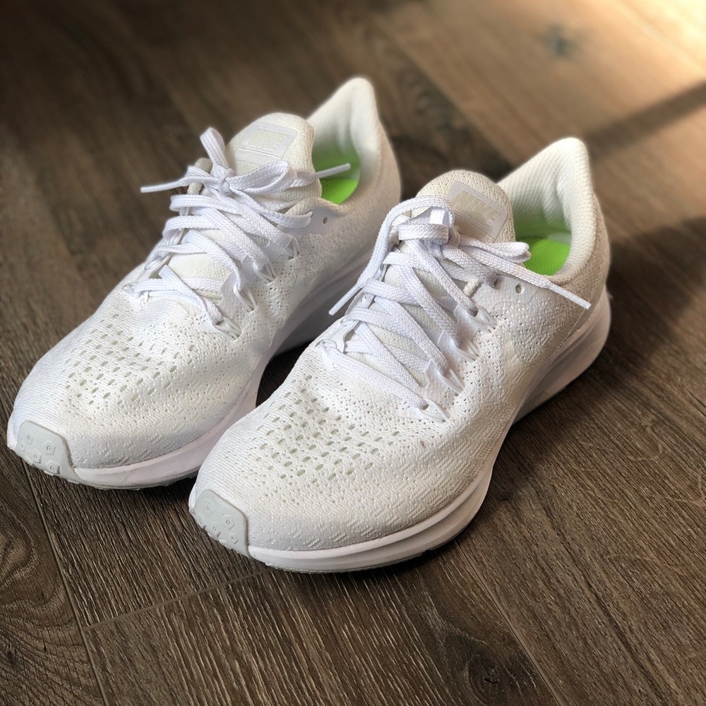 All white Nike tennis shoes